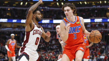 Jan 13, 2023; Chicago, Illinois, USA; Oklahoma City Thunder guard Josh Giddey (3) is defended by Chicago Bulls guard Coby White (0) : Kamil Krzaczynski-USA TODAY Sports