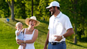 Scottie Scheffler celebrates with his wife, Meredith, and son, Bennett, after winning the Memorial Tournament at Muirfield Village Golf Club in Dublin following the final round on June 1, 2025.