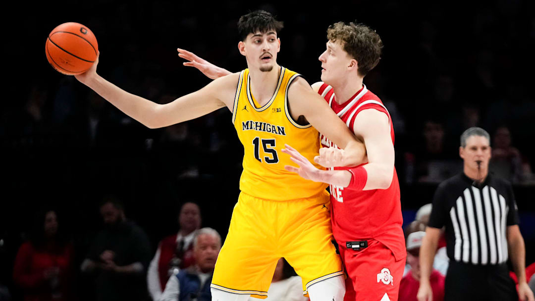 Ohio State Buckeyes center Christoph Tilly (13) defends Michigan Wolverines center Aday Mara (15) during the first half of the NCAA men's basketball game at the Schottenstein Center in Columbus on Feb. 8, 2026.