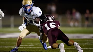 Brentwood's Clayton Merrill (4) tries to evade Franklin's Luke Thompson (16) during the first quarter at Franklin High School in Franklin, Tenn., Friday, Sept. 29, 2023.