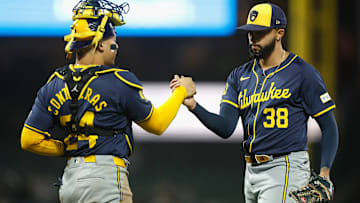 Milwaukee Brewers catcher William Contreras and closer Devin Williams celebrate a victory.