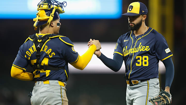 Milwaukee Brewers catcher William Contreras and closer Devin Williams celebrate a victory.