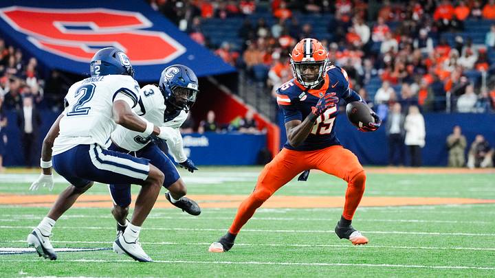Former Syracuse receiver Darrell Gill Jr. evades defenders during the Orange's 27-20 overtime victory over UConn in Week 2 of the 2025 season.