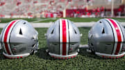 Sep 2, 2023; Bloomington, Indiana, USA; Ohio State Buckeyes helmets sit on the sideline prior to the NCAA football game at Indiana University Memorial Stadium.