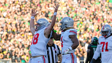 Oct 12, 2024; Eugene, Oregon, USA; Ohio State Buckeyes quarterback Will Howard (18) celebrates scoring a touchdown during the first half of the NCAA football game against the Oregon Ducks at Autzen Stadium