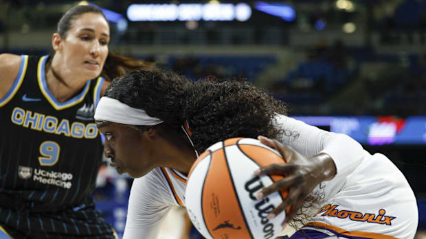 A photo of Kahleah Copper driving the ball