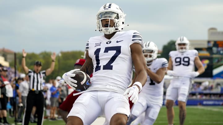 Sep 23, 2023; Lawrence, Kansas, USA; Brigham Young Cougars wide receiver Keelan Marion (17) scores a touchdown during the second half against the Kansas Jayhawks at David Booth Kansas Memorial Stadium. Mandatory Credit: Jay Biggerstaff-USA TODAY Sports