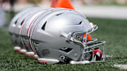 Sep 2, 2023; Bloomington, Indiana, USA; Ohio State Buckeyes helmets sit on the sideline prior to the NCAA football game at Indiana University Memorial Stadium. Ohio State won 23-3.