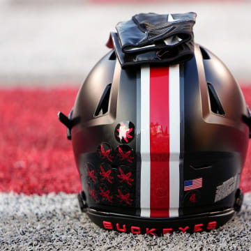 Sep 24, 2022; Columbus, Ohio, USA; A black helmet sits on the sideline as part of the special uniform the Ohio State Buckeyes will wear in the NCAA Division I football game against the Wisconsin Badgers at Ohio Stadium. Mandatory Credit: Adam Cairns-The Columbus Dispatch

Ncaa Football Wisconsin Badgers At Ohio State Buckeyes