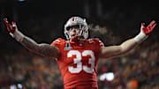 Ohio State Buckeyes defensive end Jack Sawyer (33) celebrates a sack of Tennessee Volunteers quarterback Nico Iamaleava (8) during the first half of the College Football Playoff first round game at Ohio Stadium in Columbus on Dec. 21, 2024.
