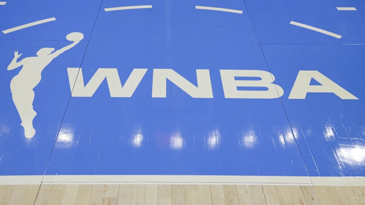 WNBA logo is seen on the court before a basketball game after the announcement of the Portland Fire expansion team.
