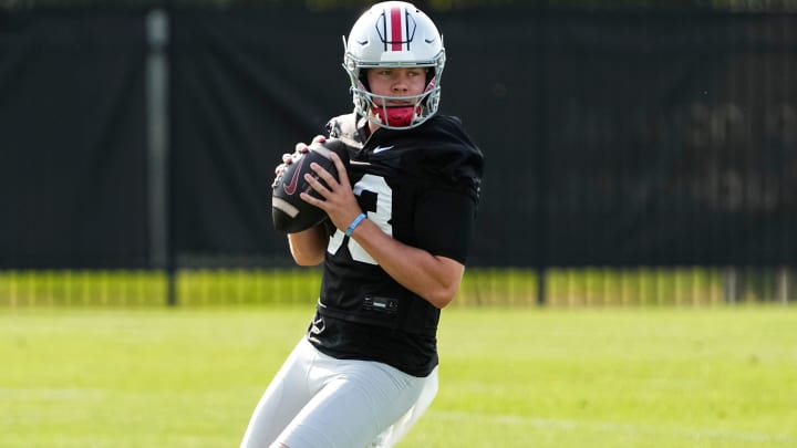 Aug 1, 2024; Columbus, OH, USA; Ohio State Buckeyes quarterback Devin Brown (33) drops back to pass during football camp at the Woody Hayes Athletic Complex.