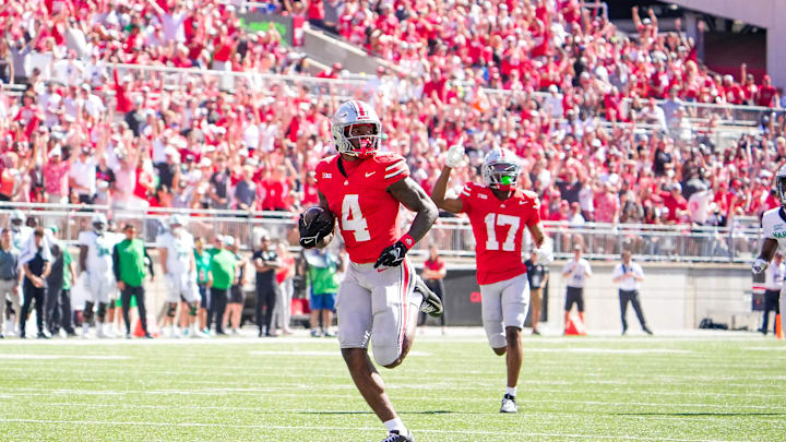Sep 21, 2024; Columbus, Ohio, USA; Ohio State Buckeyes wide receiver Jeremiah Smith (4) runs the ball in for a touchdown against the Marshall Thundering Herd in the second half at Ohio Stadium on Saturday.
