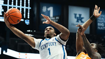 Kentucky's Lamont Butler (1) scores against Tennessee's Felix Okpara (34) during their game at Rupp Arena in Lexington, Ky. on Feb. 11, 2025.