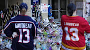 Sep 4, 2024; Columbus, OH, USA; Mourners gather for a candlelight vigil to remember Columbus Blue Jackets forward Johnny Gaudreau at Nationwide Arena. Gaudreau, along with his brother, Matthew, died in a bicycle crash last week. Mandatory Credit: Adam Cairns-Imagn Images via Columbus Dispatch/USA TODAY Network