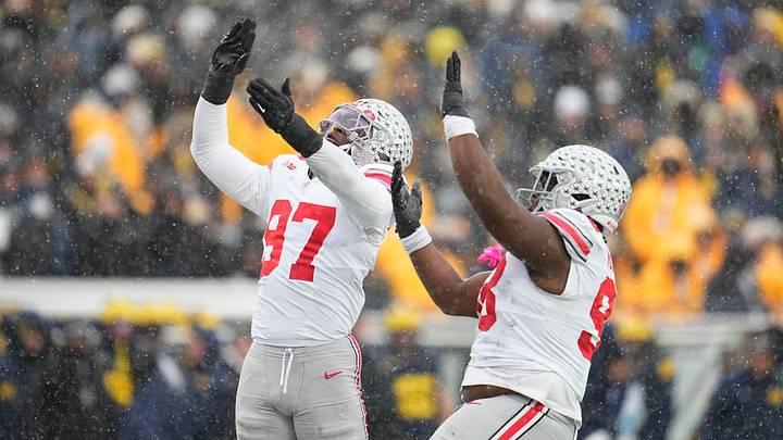 Ohio State Buckeyes defensive end Kenyatta Jackson Jr. (97) celebrates a sack of Michigan Wolverines quarterback Bryce Underwood (19) with defensive tackle Kayden McDonald (98) during the NCAA football game at Michigan Stadium in Ann Arbor, Mich. on Nov. 29, 2025. Ohio State won 27-9.