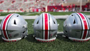 Sep 2, 2023; Bloomington, Indiana, USA; Ohio State Buckeyes helmets sit on the sideline prior to the NCAA football game at Indiana University Memorial Stadium.