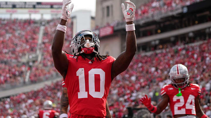 Aug 31, 2024; Columbus, OH, USA; Ohio State Buckeyes cornerback Denzel Burke (10) celebrates an interception during the first half of the NCAA football game against the Akron Zips at Ohio Stadium.