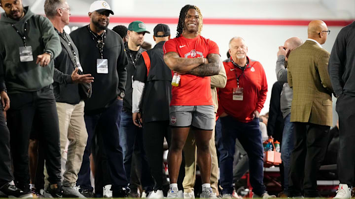 Ohio State Buckeyes running back Quinshon Judkins watches as teammates work out during the pro day for NFL scouts. Ohio State Buckeyes running back Quinshon Judkins watches as teammates work out during the pro day for NFL scouts.