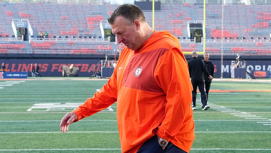 Illinois Fighting Illini head coach Bret Bielema walks across the field as the team arrives prior to the NCAA football game against the Ohio State Buckeyes at Gies Memorial Stadium in Champaign on Oct. 11, 2025.