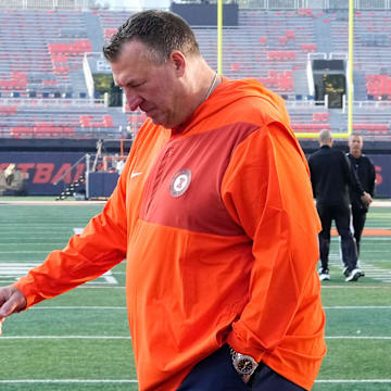 Illinois Fighting Illini head coach Bret Bielema walks across the field as the team arrives prior to the NCAA football game against the Ohio State Buckeyes at Gies Memorial Stadium in Champaign on Oct. 11, 2025.