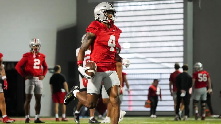 Mar 7, 2024; Columbus, OH, USA; Ohio State Buckeyes wide receiver Jeremiah Smith (4) returns a punt during spring football practice at the Woody Hayes Athletic Center.