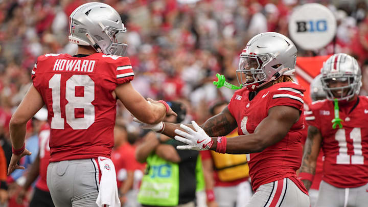 Aug 31, 2024; Columbus, OH, USA; Ohio State Buckeyes running back Quinshon Judkins (1) celebrates scoring a touchdown with quarterback Will Howard (18) during the NCAA football game against the Akron Zips at Ohio Stadium. Ohio State won 52-6.