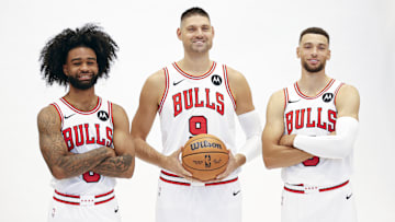 Sep 30, 2024; Chicago, Il, USA; Chicago Bulls guard Coby White (0), center Nikola Vucevic (9) and guard Zach LaVine (8) pose during Chicago Bulls Media Day. Mandatory Credit: Kamil Krzaczynski-Imagn Images