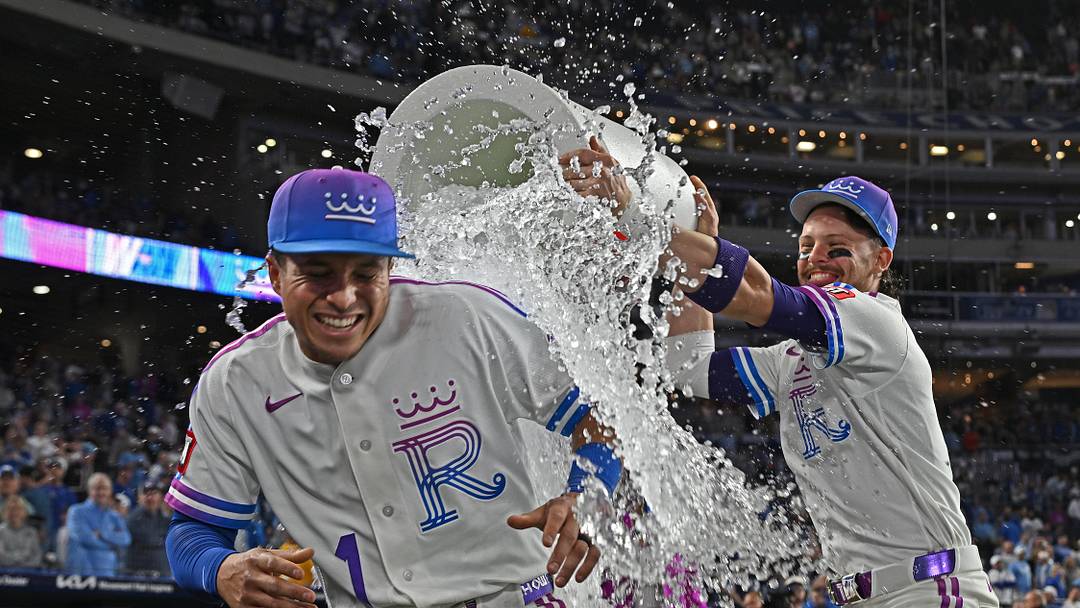 Apr 24, 2026; Kansas City, Missouri, USA;  Kansas City Royals shortstop Bobby Witt Jr. (7) douses left fielder Isaac Collins (1) with ice water after beating the Los Angeles Angels at Kauffman Stadium. Mandatory Credit: Peter Aiken-Imagn Images