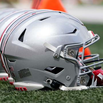 Sep 2, 2023; Bloomington, Indiana, USA; Ohio State Buckeyes helmets sit on the sideline prior to the NCAA football game at Indiana University Memorial Stadium. Ohio State won 23-3.