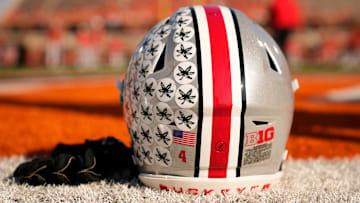 Ohio State Buckeyes wide receiver Jeremiah Smith's helmet sits on the sideline as the team warms up prior to the NCAA football game against the Illinois Fighting Illini at Gies Memorial Stadium in Champaign on Oct. 11, 2025.