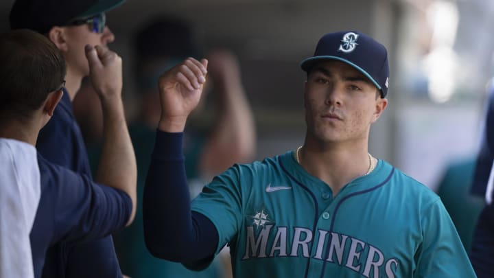 Seattle Mariners starting pitcher Bryan Woo is congratulated by teammates in the after coming off the field during the sixth inning against the Kansas City Royals in May at T-Mobile Park.