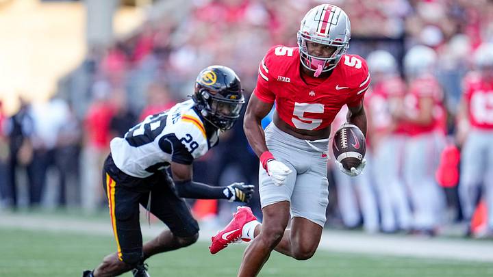 Ohio State Buckeyes wide receiver Mylan Graham (5) runs past Grambling State Tigers defensive back Christen Williams (29) during the second half of the NCAA football game at Ohio Stadium on Sept. 6, 2025. Ohio State won 70-0.