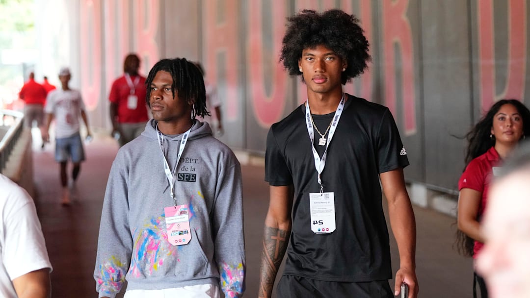 Aug 31, 2024; Columbus, OH, USA; Ohio State Buckeyes recruits Kayden Dixon-Wyatt and Chris Henry Jr. walk onto the field prior to the NCAA football game against the Akron Zips at Ohio Stadium. Ohio State won 52-6.