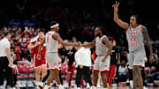 Ohio State Buckeyes guard Micah Parrish (8) celebrates a three pointer with guard Bruce Thornton (2) and forward Devin Royal (21) during the second half of the NCAA men's basketball game against the Nebraska Cornhuskers at Value City Arena in Columbus on March 4, 2025. Ohio State won 116-114.