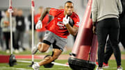 Ohio State running back TreVeyon Henderson works through a drill at a pro day in March.