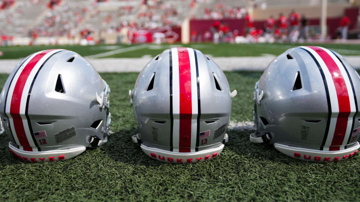 Sep 2, 2023; Bloomington, Indiana, USA; Ohio State Buckeyes helmets sit on the sideline prior to the NCAA football game at Indiana University Memorial Stadium.