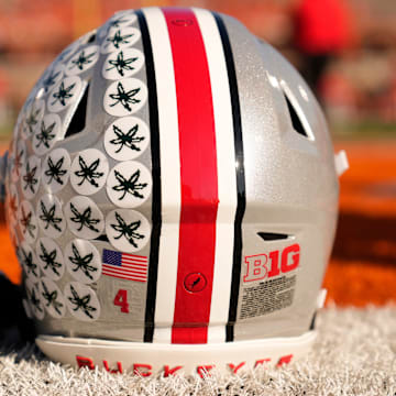 Ohio State Buckeyes wide receiver Jeremiah Smith's helmet sits on the sideline as the team warms up prior to the NCAA football game against the Illinois Fighting Illini at Gies Memorial Stadium in Champaign on Oct. 11, 2025.