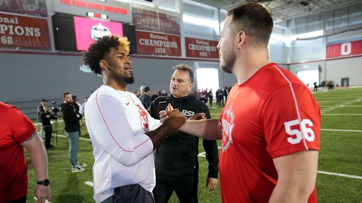 Ohio State Buckeyes offensive tackle Josh Simmons, left, talks to OSU center Seth McLaughlin at pro day on March 26. Ohio State Buckeyes offensive tackle Josh Simmons, left, talks to OSU center Seth McLaughlin at pro day on March 26.