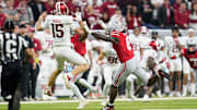 Ohio State Buckeyes linebacker Arvell Reese (8) pressures Indiana Hoosiers quarterback Fernando Mendoza (15) during the first half of the Big Ten Conference championship game at Lucas Oil Stadium in Indianapolis on Dec. 6, 2025.