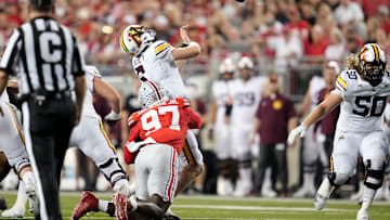Ohio State Buckeyes defensive end Kenyatta Jackson Jr. (97) hits Minnesota Golden Gophers quarterback Drake Lindsey (5) during the NCAA football game at Ohio Stadium in Columbus on Oct. 4, 2025. Jackson left the game after the hit and did not return for the remainder.