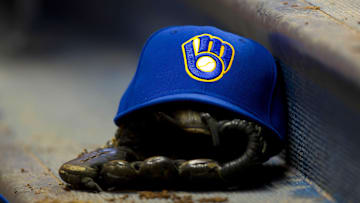 June 10, 2011; Milwaukee, WI, USA;   A Milwaukee Brewers hat and glove during the game against the St. Louis Cardinals at Miller Park.  The Brewers defeated the Cardinals 8-0. Mandatory Credit: Jeff Hanisch-Imagn Images
