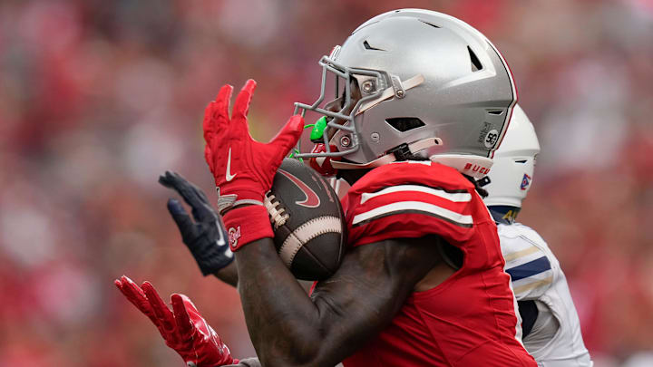 Aug 31, 2024; Columbus, OH, USA; Ohio State Buckeyes wide receiver Jeremiah Smith (4) catches a pass during the second half of the NCAA football game against the Akron Zips at Ohio Stadium. Ohio State won 52-6.