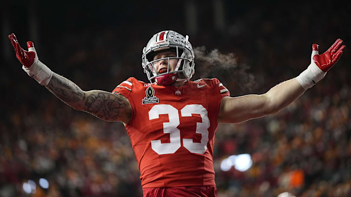 Ohio State Buckeyes defensive end Jack Sawyer (33) celebrates a sack of Tennessee Volunteers quarterback Nico Iamaleava (8) during the first half of the College Football Playoff first round game at Ohio Stadium in Columbus on Dec. 21, 2024.