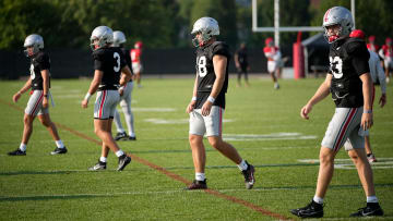 Aug 8, 2024; Columbus, Ohio; Ohio State quarterbacks, from right, Devin Brown, Will Howard, Lincoln Kienholz, and Julian Sayin.