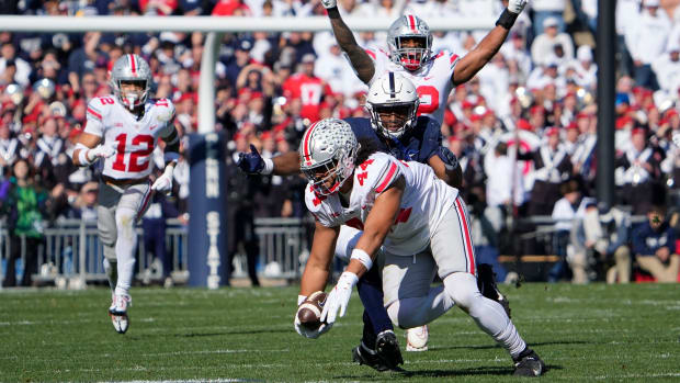 Defensive end leans down for interception.