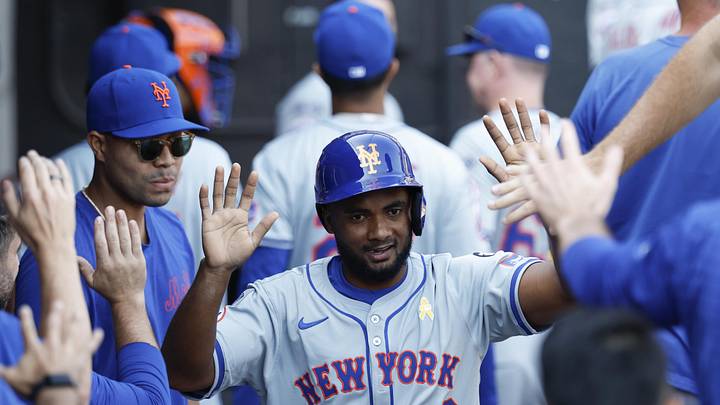 Sep 1, 2024; Chicago, Illinois, USA; New York Mets infielder Pablo Reyes (26) celebrates with teammates after scoring against the Chicago White Sox during the ninth inning at Guaranteed Rate Field. Mandatory Credit: Kamil Krzaczynski-Imagn Images