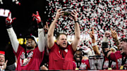 Indiana head coach Curt Cignetti hoists the trophy after winning the Big Ten championship game. Will the No. 1 Hoosiers claim their first football national championship this season? 