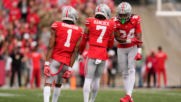 Oct 21, 2023; Columbus, Ohio, USA; Ohio State Buckeyes cornerback Davison Igbinosun (1), cornerback Jordan Hancock (7) and cornerback Jermaine Mathews Jr. (24) celebrate during the NCAA football game against the Penn State Nittany Lions at Ohio Stadium.