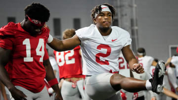 Mar 5, 2024; Columbus, OH, USA; Ohio State Buckeyes safety Caleb Downs (2) stretches with wide receiver Kojo Antwi (14) during the first spring practice at the Woody Hayes Athletic Center.